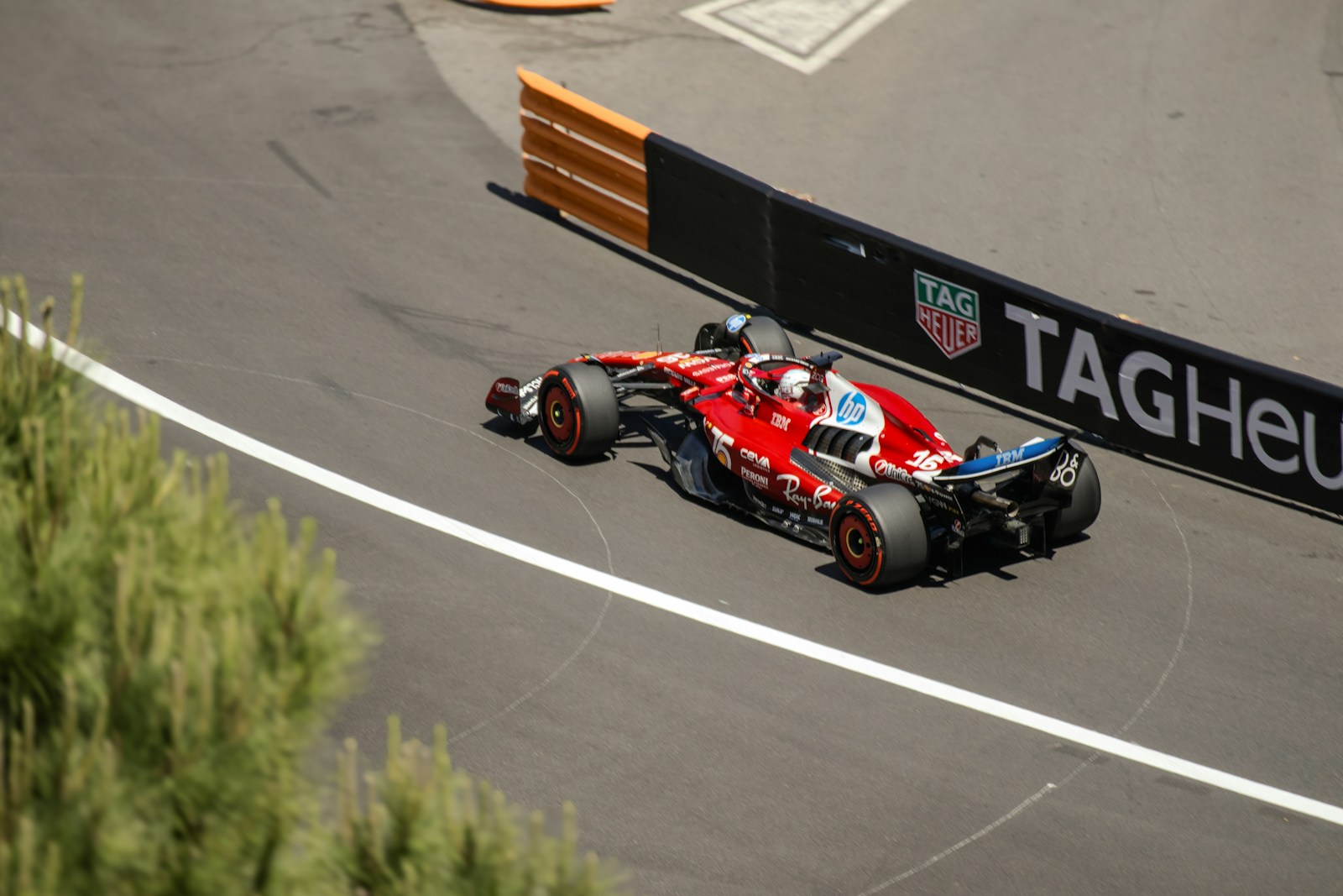 A formula 1 car speeds around a racetrack.
